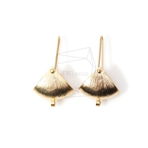 May include: A pair of gold-toned earring findings with a fan-shaped design. The findings have a hook closure and a small loop at the bottom.