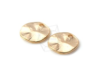 May include: Two gold-toned metal round disc charms with a hammered texture and a small hole at the top.