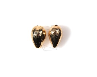 May include: Two gold-colored metal teardrop-shaped beads.