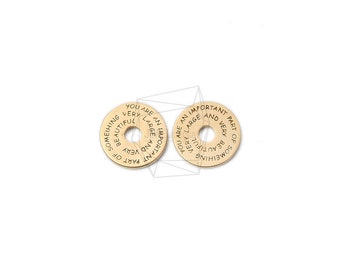 May include: Two gold-colored metal discs with the text "You are an important part of something very beautiful and very large" inscribed around the edge.