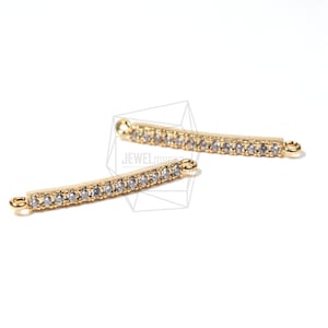May include: Two gold-toned metal bar connectors with clear crystal embellishments. Each connector has two loops at the ends.