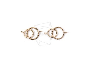 Puede incluir: Dos cierres de metal dorado con un diseño de cuerda trenzada. Cada cierre tiene una forma circular con un círculo más pequeño en el interior.
