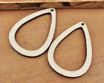 May include: Two unfinished wooden teardrop-shaped earring blanks with a hole at the top.
