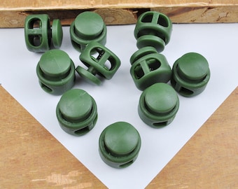 10 topes de cordón de plástico, topes de botón de resorte verde militar, topes de cordón de doble orificio, topes de cordón elásticos, topes para mascarillas, cordón