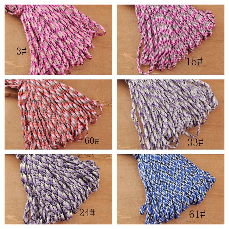 May include: A collection of colorful braided cords in various hues, including pink, purple, red, and blue. Each bundle is labeled with a number. The cords are tightly woven, creating a textured appearance. Ideal for crafting and DIY projects.