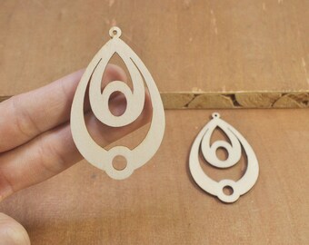 May include: Two unfinished wooden teardrop-shaped earrings with a layered design. The earrings have a hole at the top for hanging.