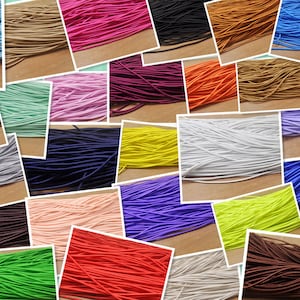May include: Assortment of colourful elastic cords in various colours, including blue, green, red, yellow, orange, purple, pink, brown, black, and white. The cords are arranged in rows and are all the same size.