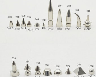 May include: A set of 39 silver metal studs in various shapes and sizes. The studs are numbered 20 through 39 and have measurements in inches and millimetres.