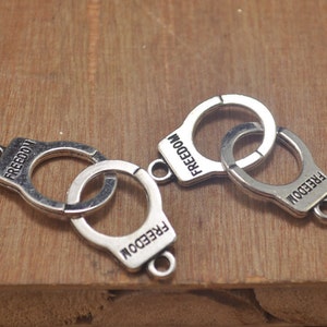 Handcuffs,20pcs Antique Silver handcuffs Charms, Handcuffs pendants,use for necklaces and bracelets--40x15mm.