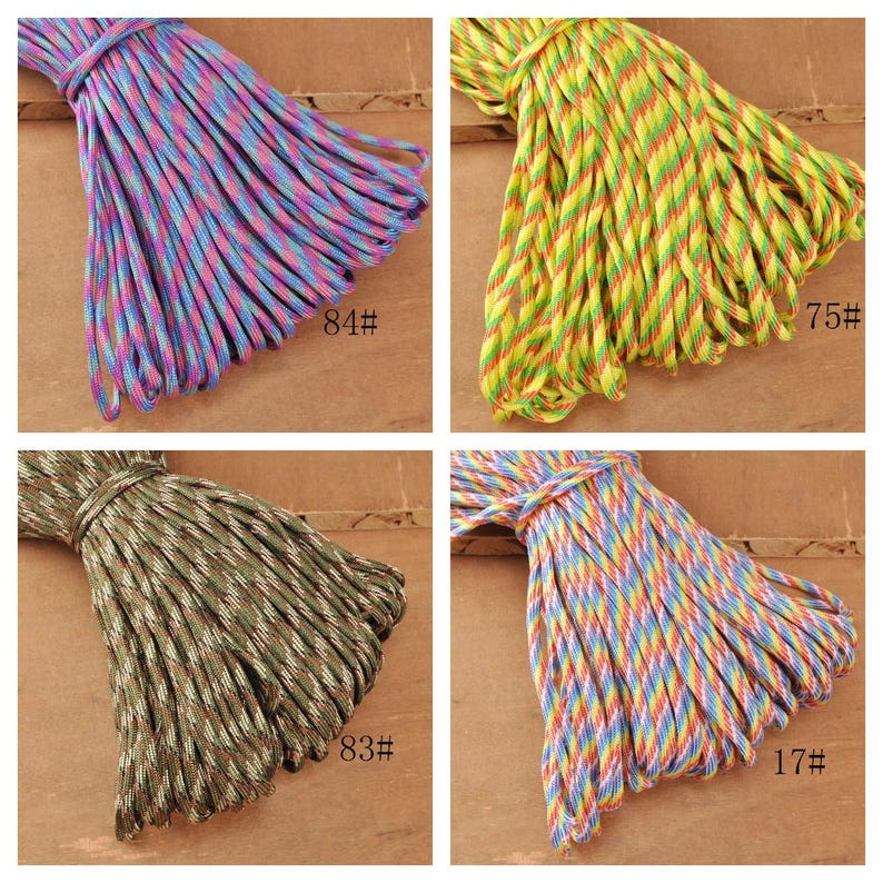May include: Four bundles of colorful paracord rope. One bundle is blue, pink, and purple. Another is yellow, green, and red. The third is green, brown, and tan. The last is blue, yellow, and red. Each bundle has a number on it.
