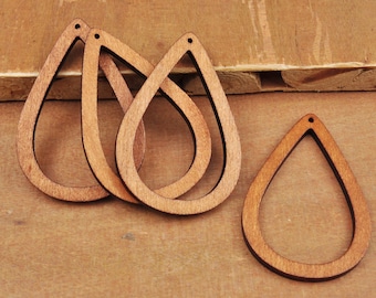 May include: Four unfinished wooden teardrop-shaped earring blanks. The blanks are approximately 2 inches in length and have a hole at the top for attaching earring findings.