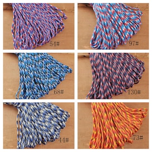 May include: A collage of six bundles of colorful paracord. The cords are in various patterns and colors, including red, blue, white, and yellow. Each bundle has a number label. The cords are tightly wound and appear to be new.