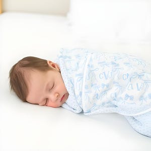 Personalized Baby Girl Swaddle in Monogram Blue Bows Print – Soft Stretchy Knit or Satin Trimmed Receiving Blanket