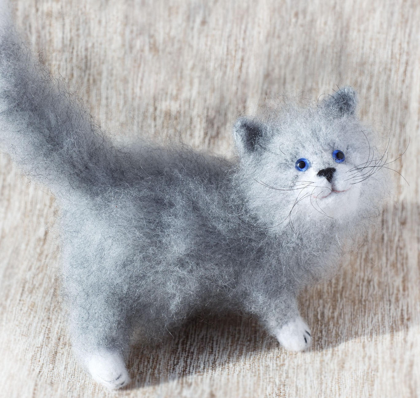 gray and white stuffed cat