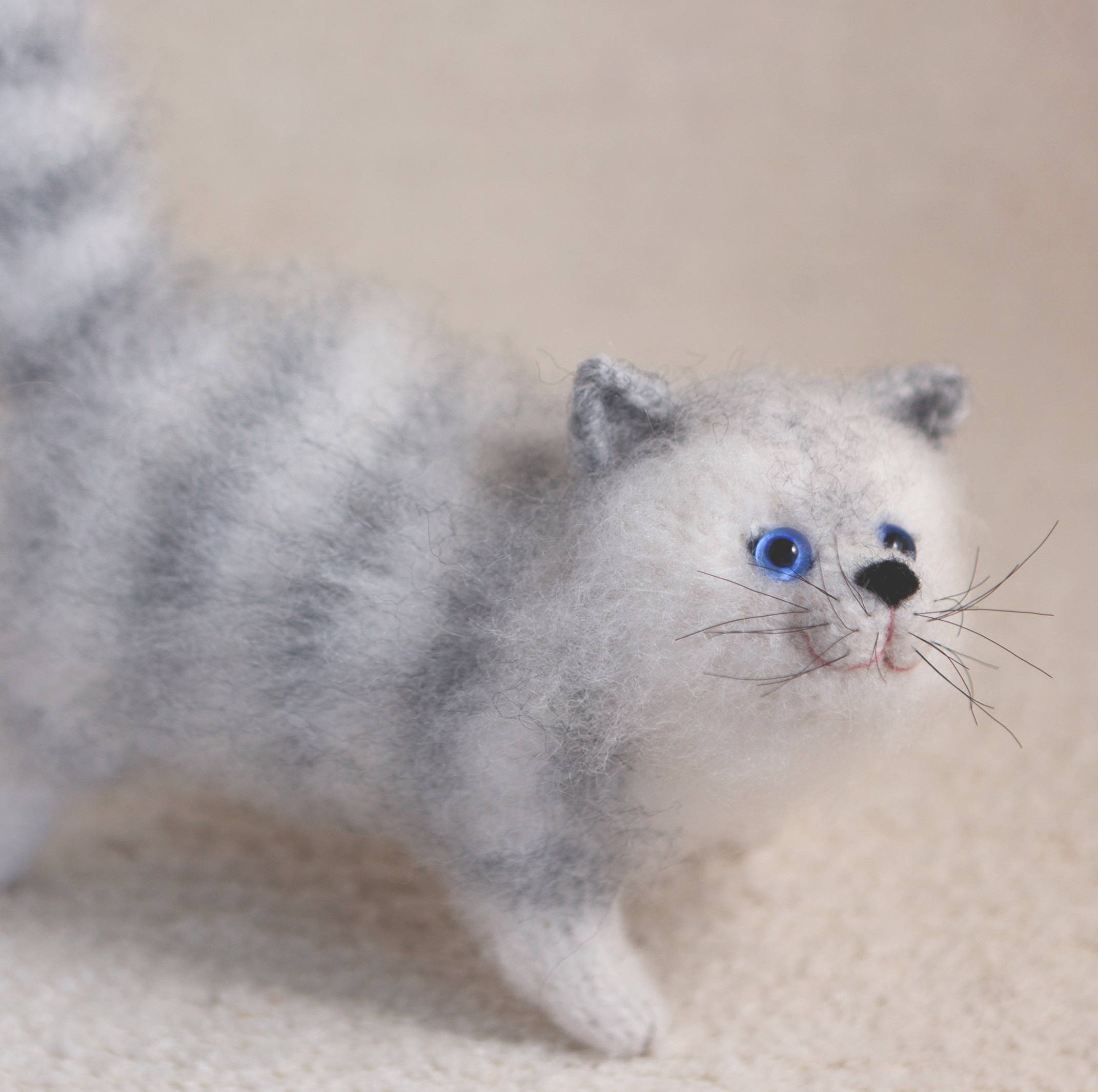 gray and white stuffed cat