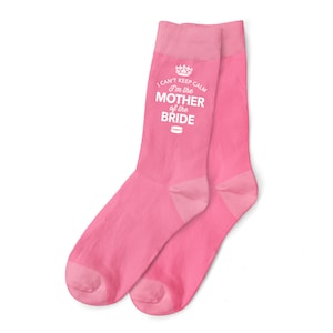 May include: A pair of pink socks with a white design that says "I can't keep calm I'm the Mother of the Bride".