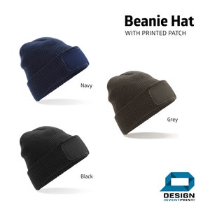 May include: Three beanie hats with a blank patch for customization. The hats are in navy, grey, and black.