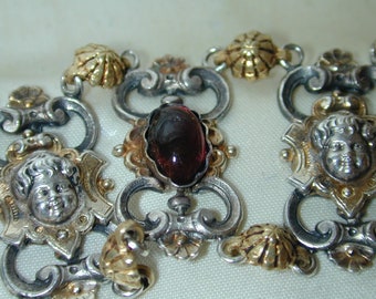 Vintage Victorian Silver and Gold Cherub Garnet Cabochon Link Bracelet, Case Not original to the piece. Will be placed in New Box.   Ornate!