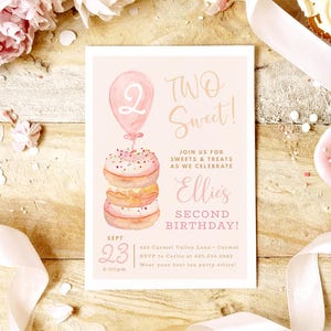 May include: A light pink invitation card with the text "Two Sweet!" and "Ellie's Second Birthday!" features a watercolor illustration of a stack of donuts topped with a balloon. The date is September 23rd.