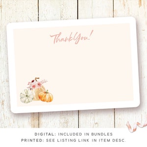 May include: A pink thank you card with a watercolor illustration of pumpkins and flowers. The text "Thank You!" is written in pink script. The card is on a white wood background.
