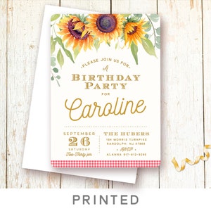 May include: A white invitation with a gold border and a watercolor illustration of sunflowers. The text reads "Please join us for a birthday party for Caroline, September 26, Saturday, Two-Thirty pm, The Hubers, 194 Morris Turnpike, Randolph, NJ 07869, RSVP, Alanna 917-612-9290".