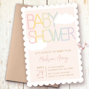 Op de afbeelding: Een roze babyborrel uitnodiging met een gegolfde rand. De uitnodiging heeft een kleurrijke "BABY SHOWER" afbeelding met wolken. De tekst luidt "Let's celebrate the mommy-to-be! Madison Avery March 24 2-5 PM The Avery Residence 245 Morning Glory Lane, Carmel RSVP to Carlie 425.243.9921 Registry at Pottery Barn Kids"