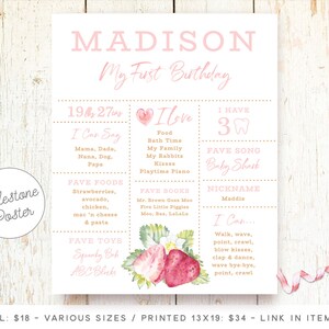 May include: A pink and gold milestone poster for a first birthday with the name Madison. The poster includes a list of things the baby can say, favorite foods, toys, books, and songs. It also includes a section for the baby's nickname and what they can do.