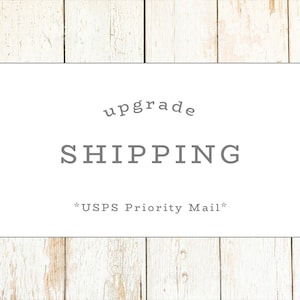May include: White rectangular label with the text "upgrade SHIPPING *USPS Priority Mail*" in gray.