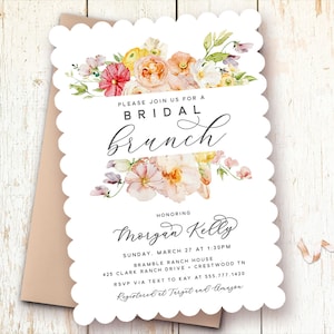 Peut inclure: Une invitation blanche &agrave; bord festonn&eacute; avec un motif floral aquarelle dans des tons de rose, jaune et vert. Le texte indique "Veuillez nous rejoindre pour un brunch de mariage en l'honneur de Morgan Kelly, dimanche 27 mars &agrave; 13h30, Bramble Ranch House, 425 Clark Ranch Drive, Crestwood TN, RSVP par SMS &agrave; Kay au 555.777.1420, Enregistr&eacute; chez Target et Amazon."