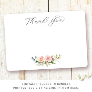 May include: A white thank you card with a simple black script font that says "Thank you". The card has a floral design in the bottom right corner with pink and white flowers and green leaves.