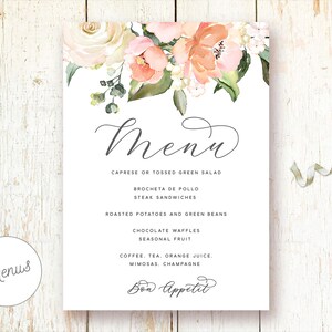 May include: A printable wedding menu template with a floral design featuring peach, pink, and white flowers. The menu includes a list of food and drink options, including Caprese or Tossed Green Salad, Brocheta de Pollo, Steak Sandwiches, Roasted Potatoes and Green Beans, Chocolate Waffles, Seasonal Fruit, Coffee, Tea, Orange Juice, Mimosas, Champagne, and Bon Appetit.