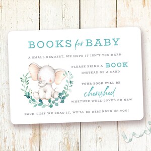 May include: A white card with blue text that says "BOOKS for BABY".  The card features a watercolor illustration of a baby elephant with green leaves. The text on the card reads: "A small request, we hope it isn't too hard. Please bring a book instead of a card. Your book will be cherished whether well-loved or new. Each time we read it, we'll be reminded of you!"