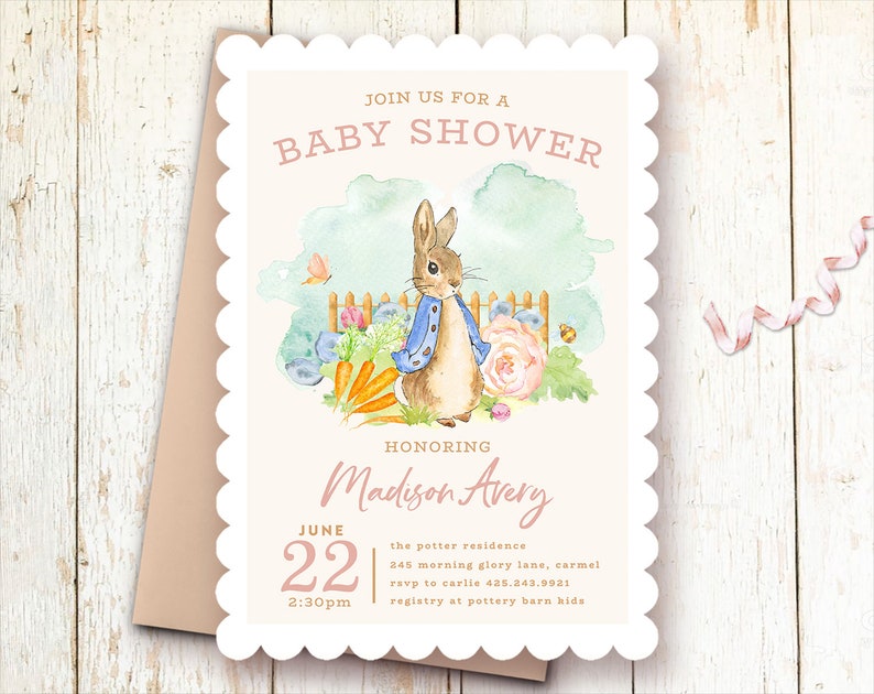 May include: A white baby shower invitation with a scalloped border. The invitation features a watercolor illustration of Peter Rabbit in a garden setting. The text reads "Join us for a Baby Shower Honoring Madison Avery June 22 2:30pm the potter residence 245 morning glory lane, carmel rsvp to carlie 435.243.9931 registry at pottery barn kids"