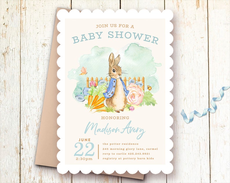 May include: A white baby shower invitation with a scalloped border. The invitation features a watercolor illustration of Peter Rabbit in a garden setting. The text reads "Join us for a Baby Shower Honoring Madison Avery June 22 2:30pm the potter residence 245 morning glory lane, carmel rsvp to carlie 435.243.9931 registry at pottery barn kids"