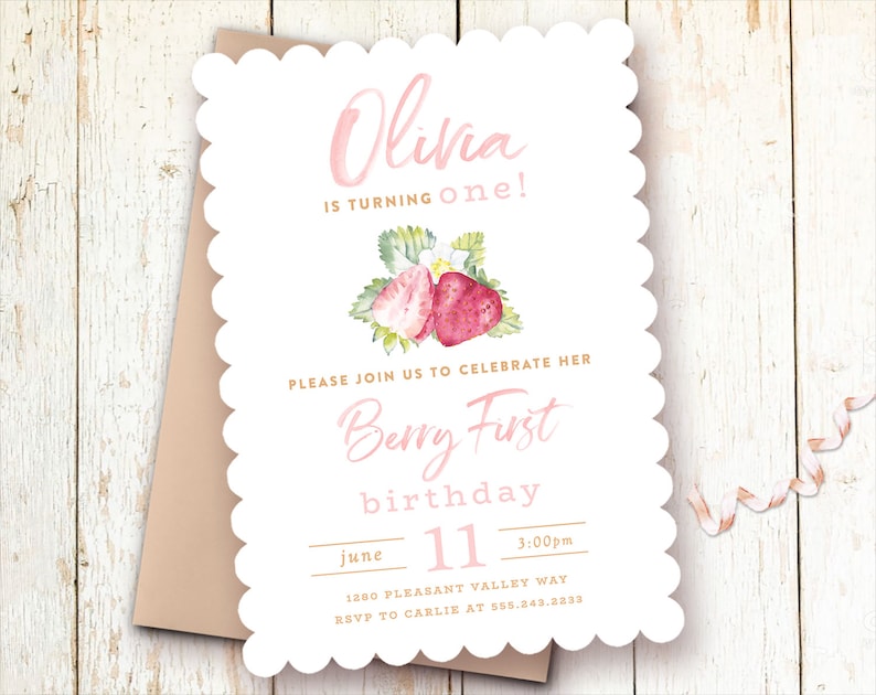May include: A pink and white invitation with a watercolor illustration of strawberries. The text reads "Olivia is turning one!" and "Berry First birthday". The date is June 11th at 3:00pm. The address is 1280 Pleasant Valley Way and the RSVP information is to Carlie at 555.243.2233.