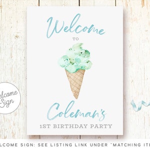 May include: Welcome sign for a 1st birthday party with a watercolor illustration of a green ice cream cone. The sign says "Welcome to Coleman's 1st Birthday Party".
