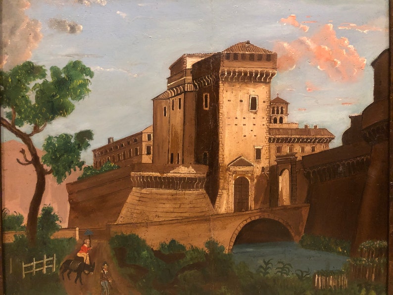 May include: A painting depicting a large, brown stone building with a bridge and a river in the foreground. A person on horseback is riding along a path in front of the building.