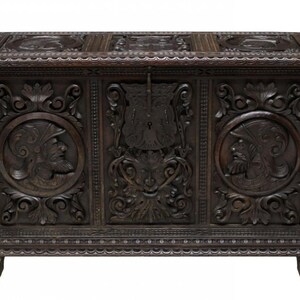 Elaborately Carved 19th Century Spanish Trunk with Armour Helmeted Busts