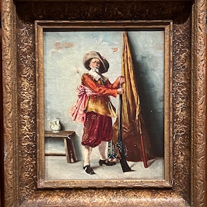 May include: An oil painting of a man in a red and gold costume holding a rifle and standing next to a flag. He is wearing a hat with a feather and has a white beard. The painting is set against a blue and white background.