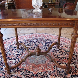 Louis XVI Style Carved Mahogany Center Table with Flame Finial