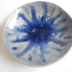 Handmade blue white pottery bowl with organic shape and textured underside image 1