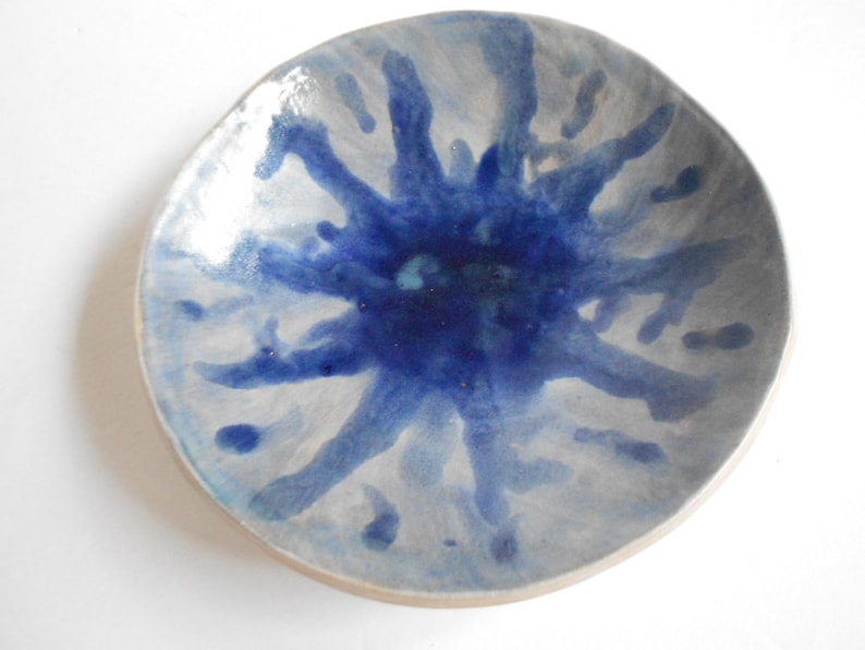 Handmade blue white pottery bowl with organic shape and textured underside image 1