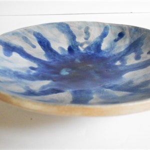 Handmade blue white pottery bowl with organic shape and textured underside image 2