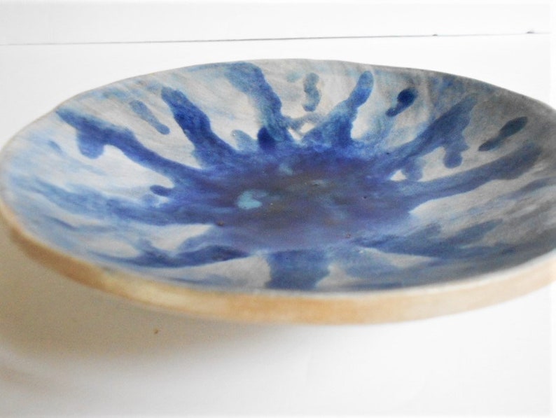 Handmade blue white pottery bowl with organic shape and textured underside image 2