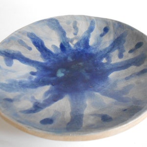 Handmade blue white pottery bowl with organic shape and textured underside image 3