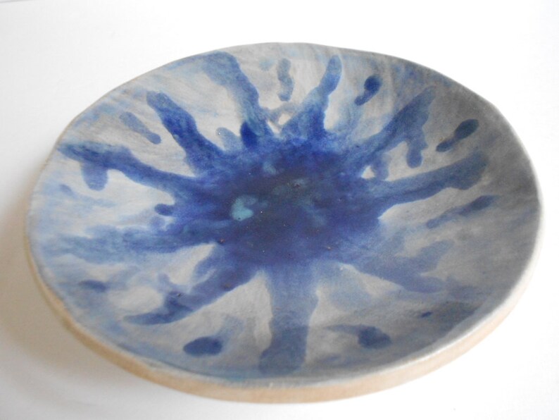 Handmade blue white pottery bowl with organic shape and textured underside image 3