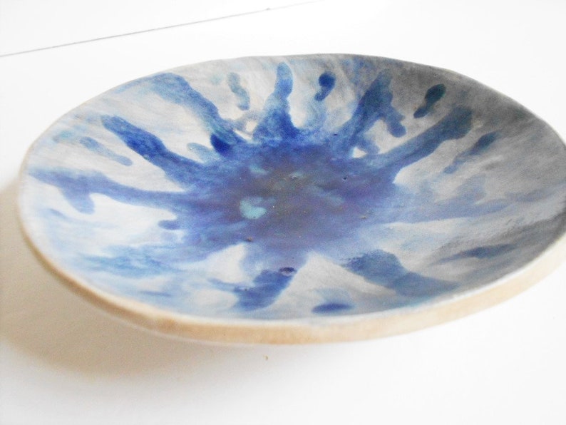 Handmade blue white pottery bowl with organic shape and textured underside image 7