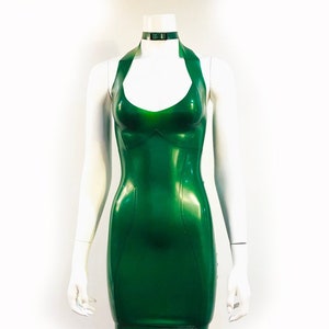 May include: A halter-style dress made of shiny green latex. The dress has a fitted bodice and a short skirt.