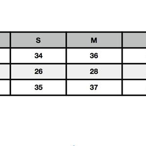 May include: Size chart showing bust, waist, and hip measurements in inches for sizes XS, S, M, L, and XL.