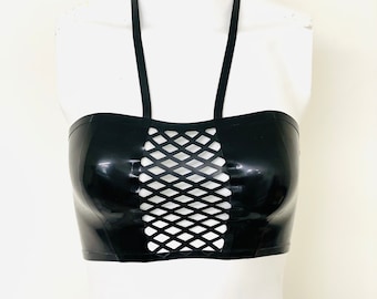 May include: A black halter top with a mesh panel in the front. The top is made of a shiny, smooth material.